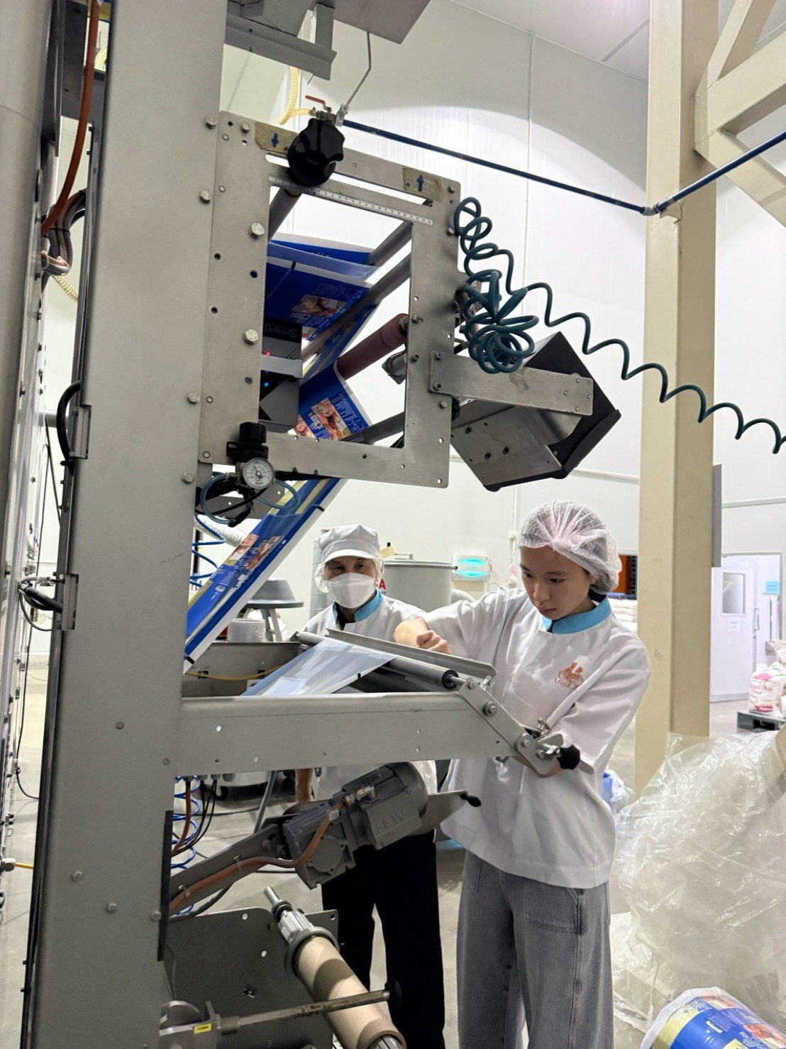 Winnie adjusting the packaging film feed