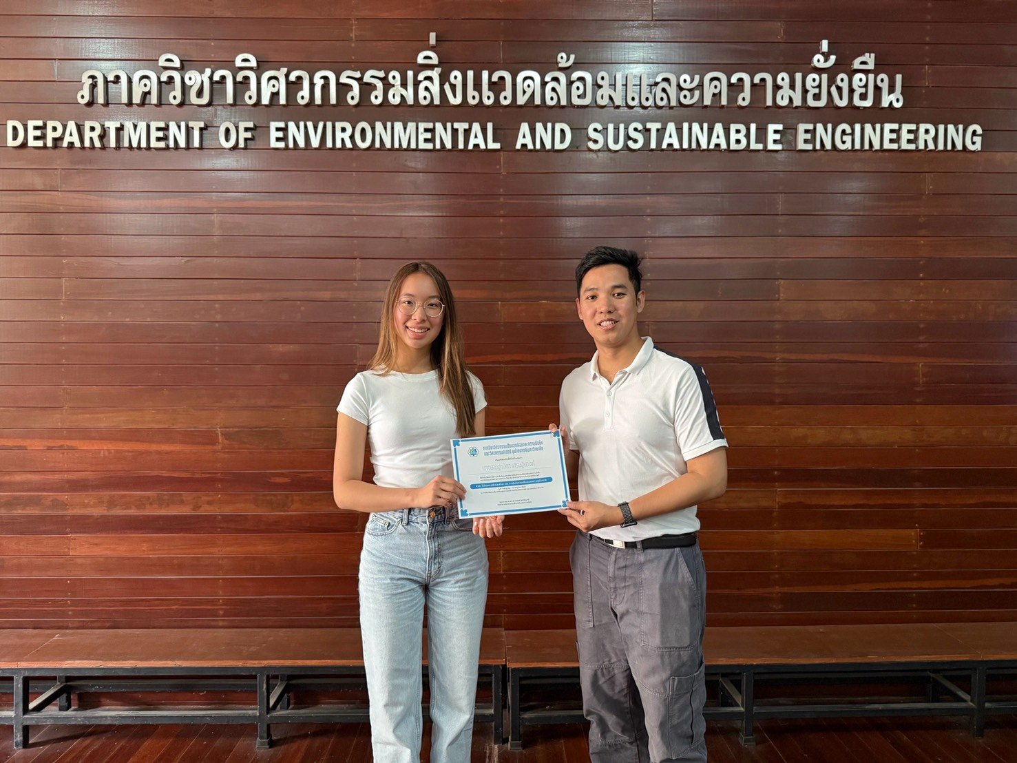 Winnie receiving her internship certificate at the Department of Environmental and Sustainable Engineering