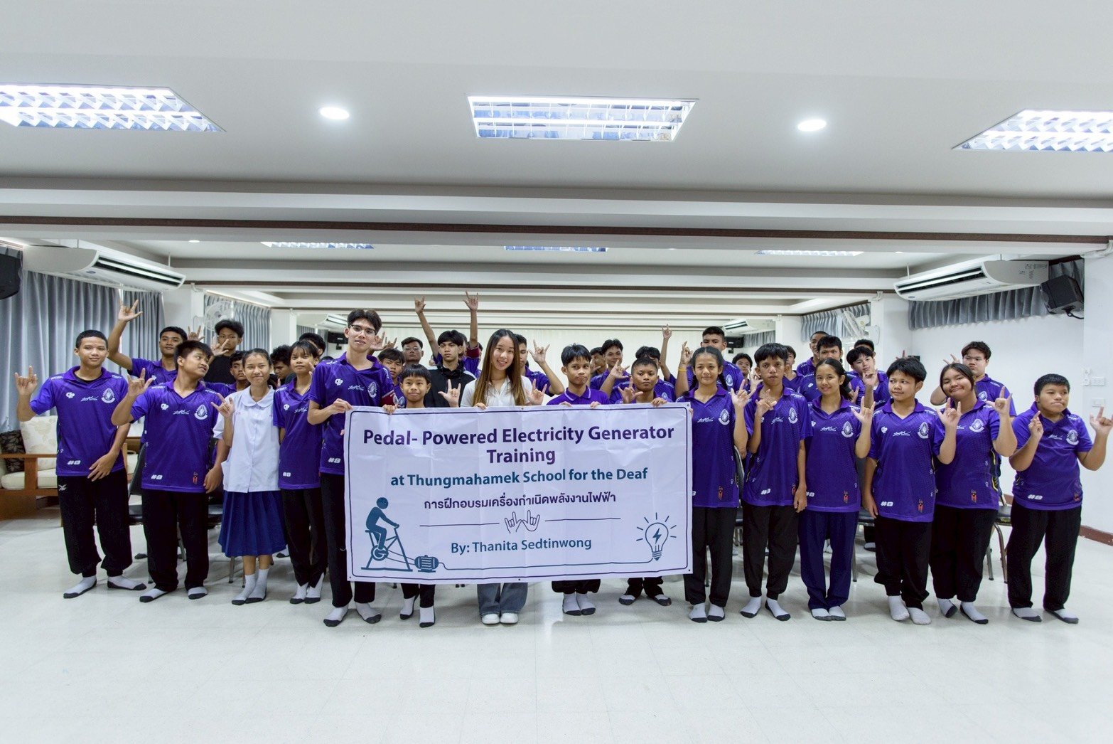 Group photo at the pedal-powered electricity generator training at Thungmahamek School for the Deaf