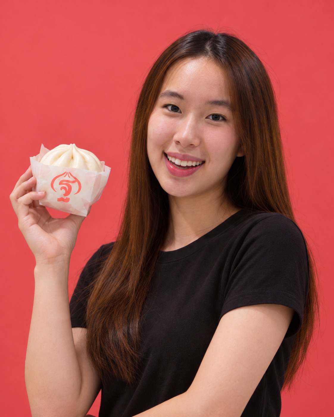 Winnie holding a THAN BAO steamed bun