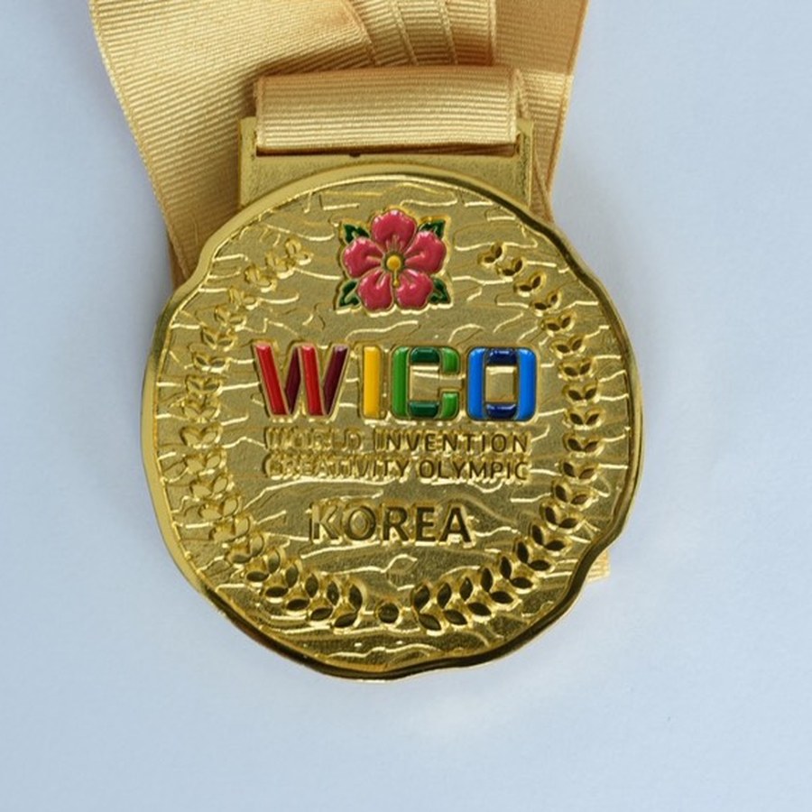 WICO 2026 gold medal with ribbon